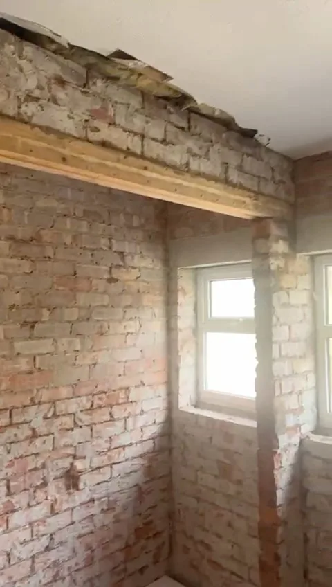 Bathroom stripped back to bare brick and re-framed before rebuilding
